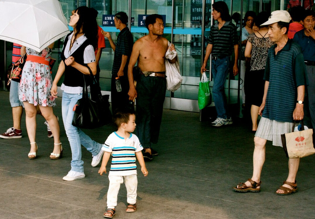 father with stroller in station