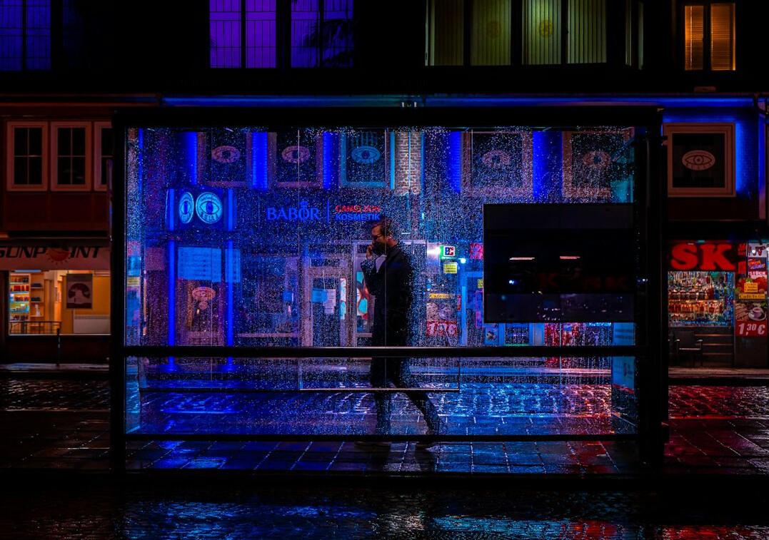 people waiting at city bus stop