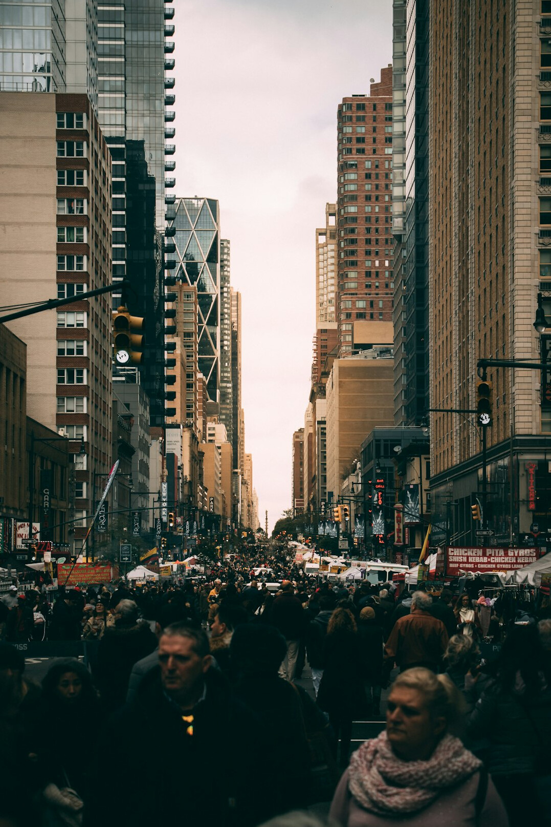 Wide view of a busy downtown Canadian street with pedestrians and traffic