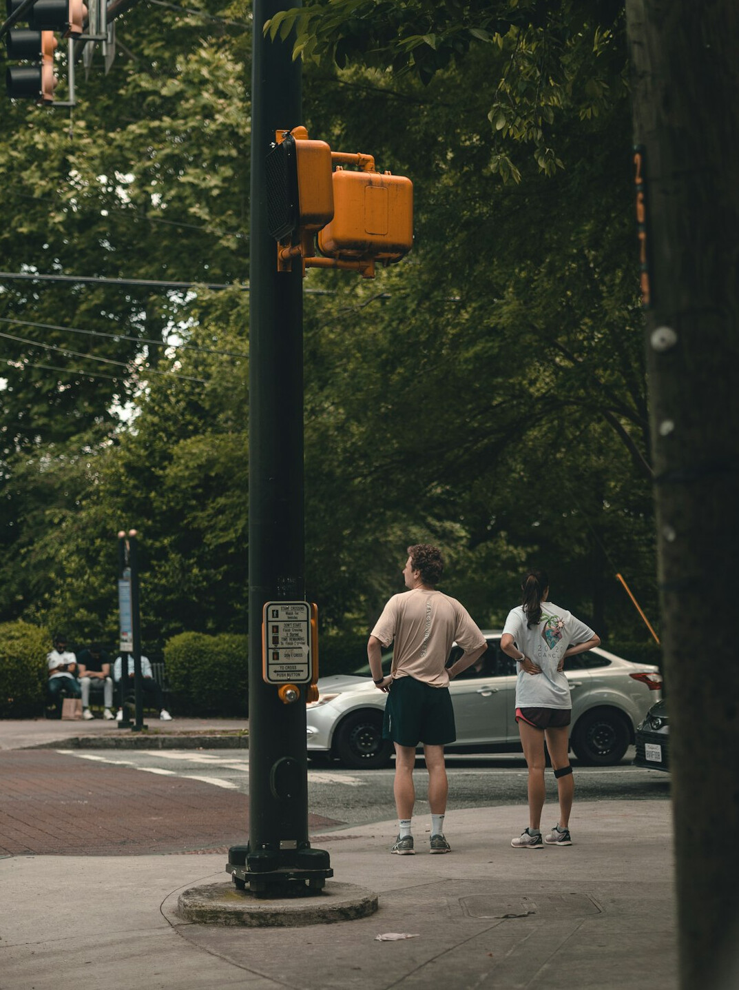 people waiting at urban crosswalk